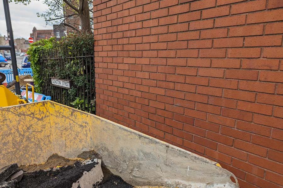 A brick wall after undergoing graffiti removal